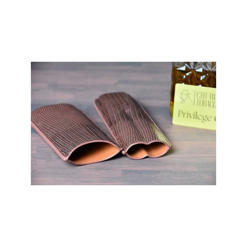 Alligator cigar case holds 2 cigars