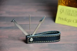 Foldable pipe holder with tool kit