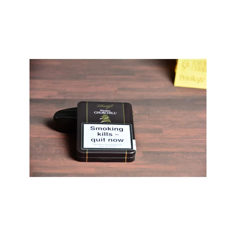 Empty small metal cigar tin Late hour